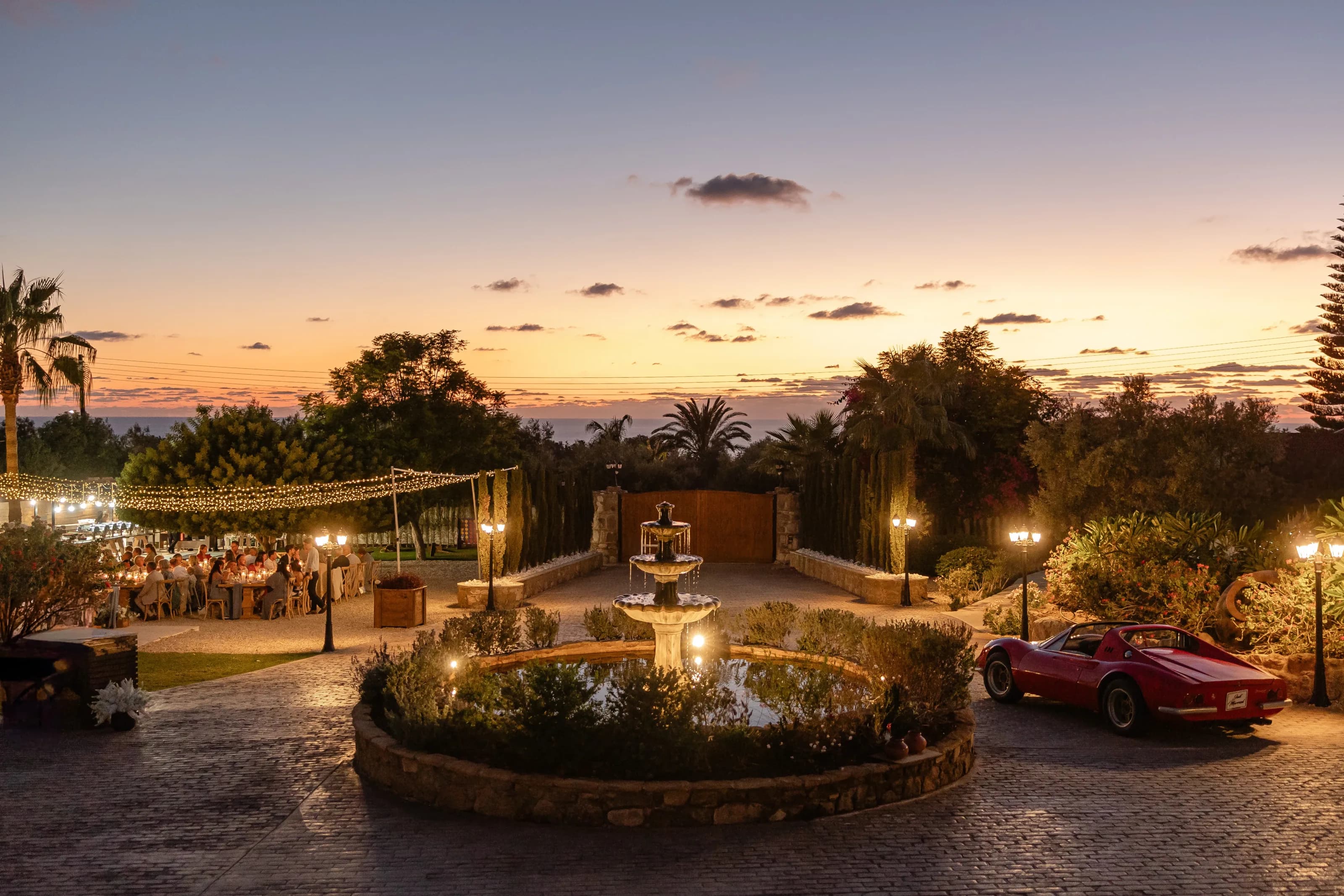 Night-time exterior of L'Chateau wedding venue in Paphos